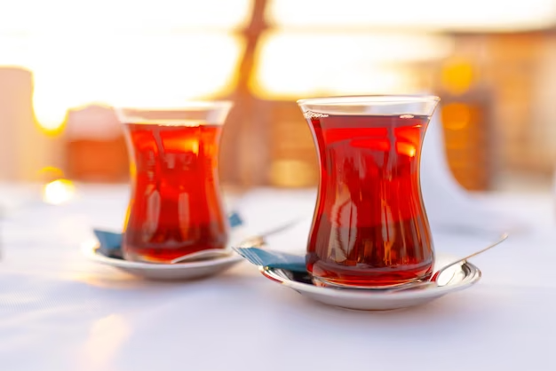 two-glasses-with-turkish-tea-white-table_93675-139469